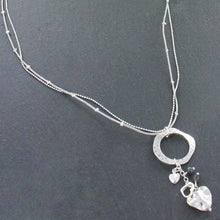 Load image into Gallery viewer, Beaten Ring Necklace With Heart Charms In Silver Plate