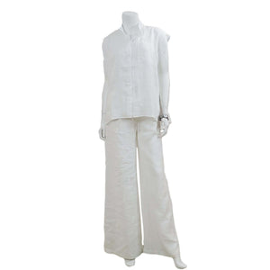 White linen blouse with cap sleeves and patch pocket. Made in Canada  Edit alt text